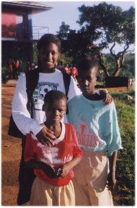 Tylar Bertie, group member, and two boys from the St. John Bosco Home for Boys